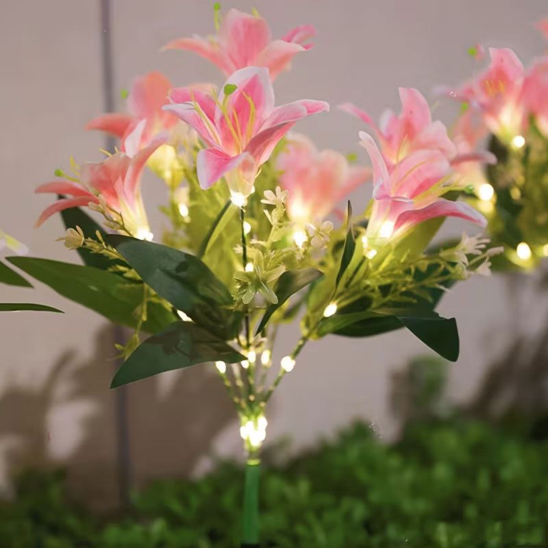 Seven Branch Solar Lily Light: Charges during the day, glows at night. Seven lilies bloom together, soft light flows like water through your garden./Light blue