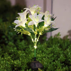 Seven Branch Solar Lily Light: Charges during the day, glows at night. Seven lilies bloom together, soft light flows like water through your garden./Light blue