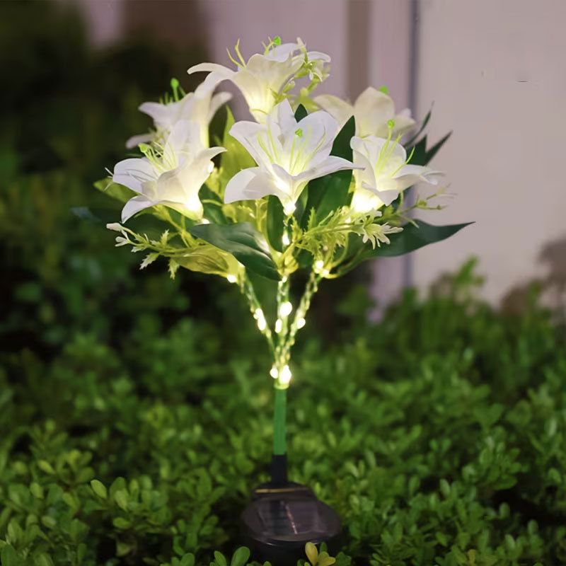 Seven Branch Solar Lily Light: Charges during the day, glows at night. Seven lilies bloom together, soft light flows like water through your garden./Light blue