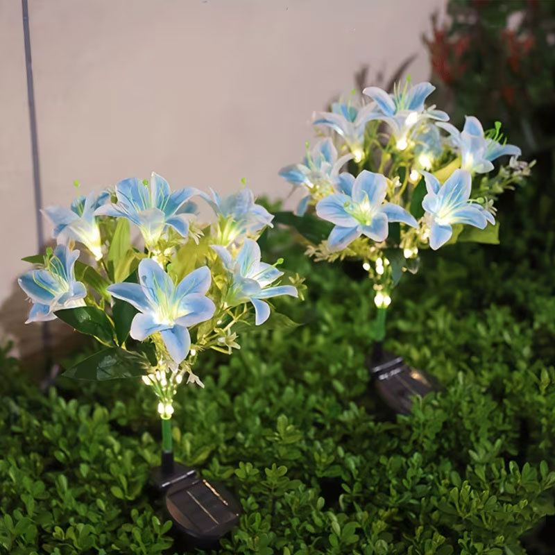 Seven Branch Solar Lily Light: Charges during the day, glows at night. Seven lilies bloom together, soft light flows like water through your garden./Light blue