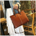 Black Elegant Leather Handbag - StylishTote with Adjustable Strap, Spacious and Durable